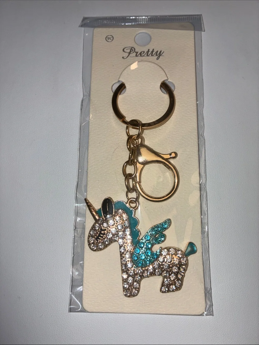 Gold Unicorn Keychain with Teal and Clear Crystal Accents